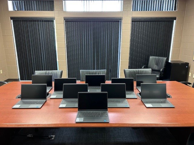 Laptops sitting on a table.
