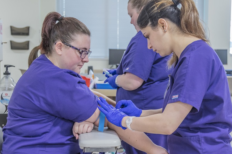 JCTC medical tech students drawing blood