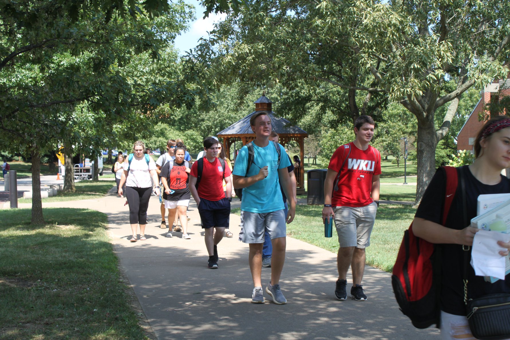 students walking across OCTC campus