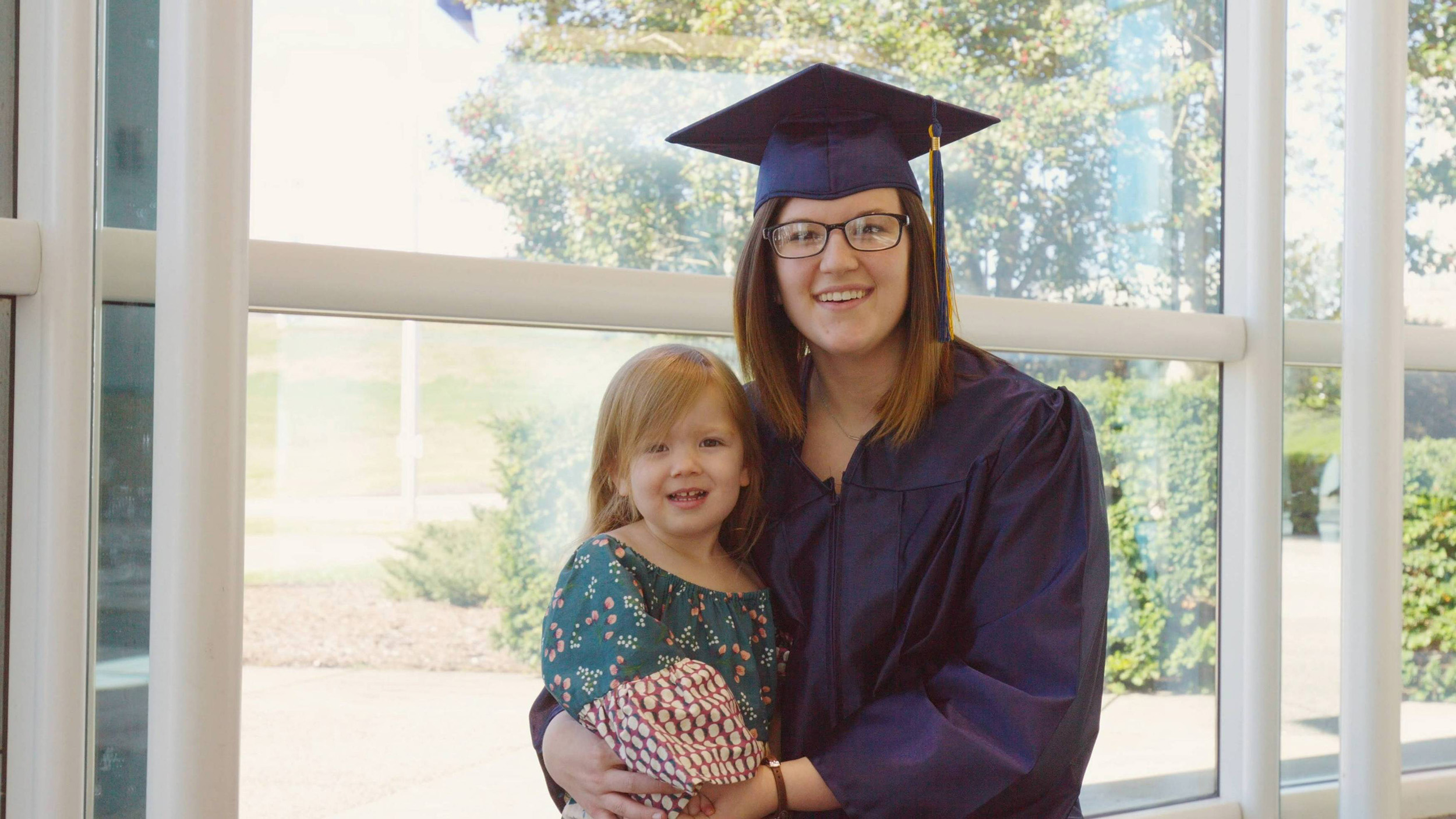 SCC graduate with child