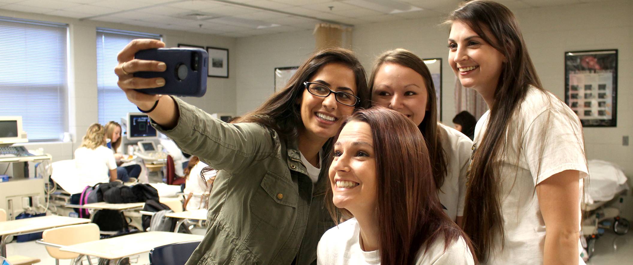 students taking selfie in nursing lab