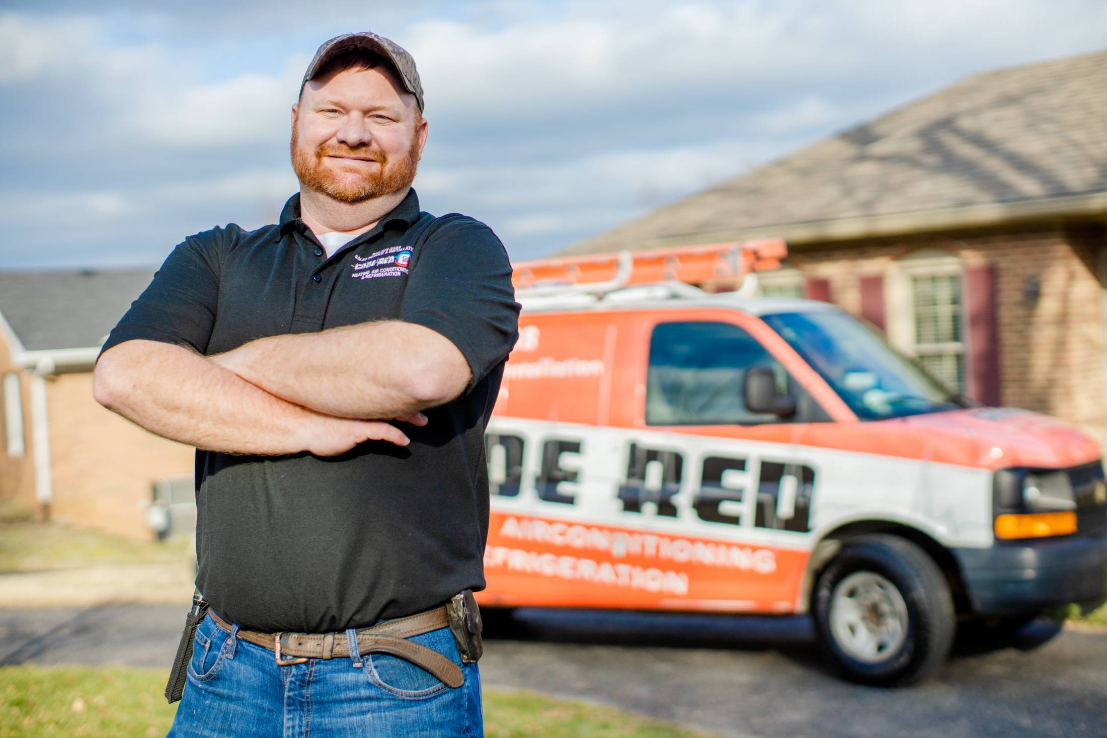 BCTC HVAC alumni in front of work van